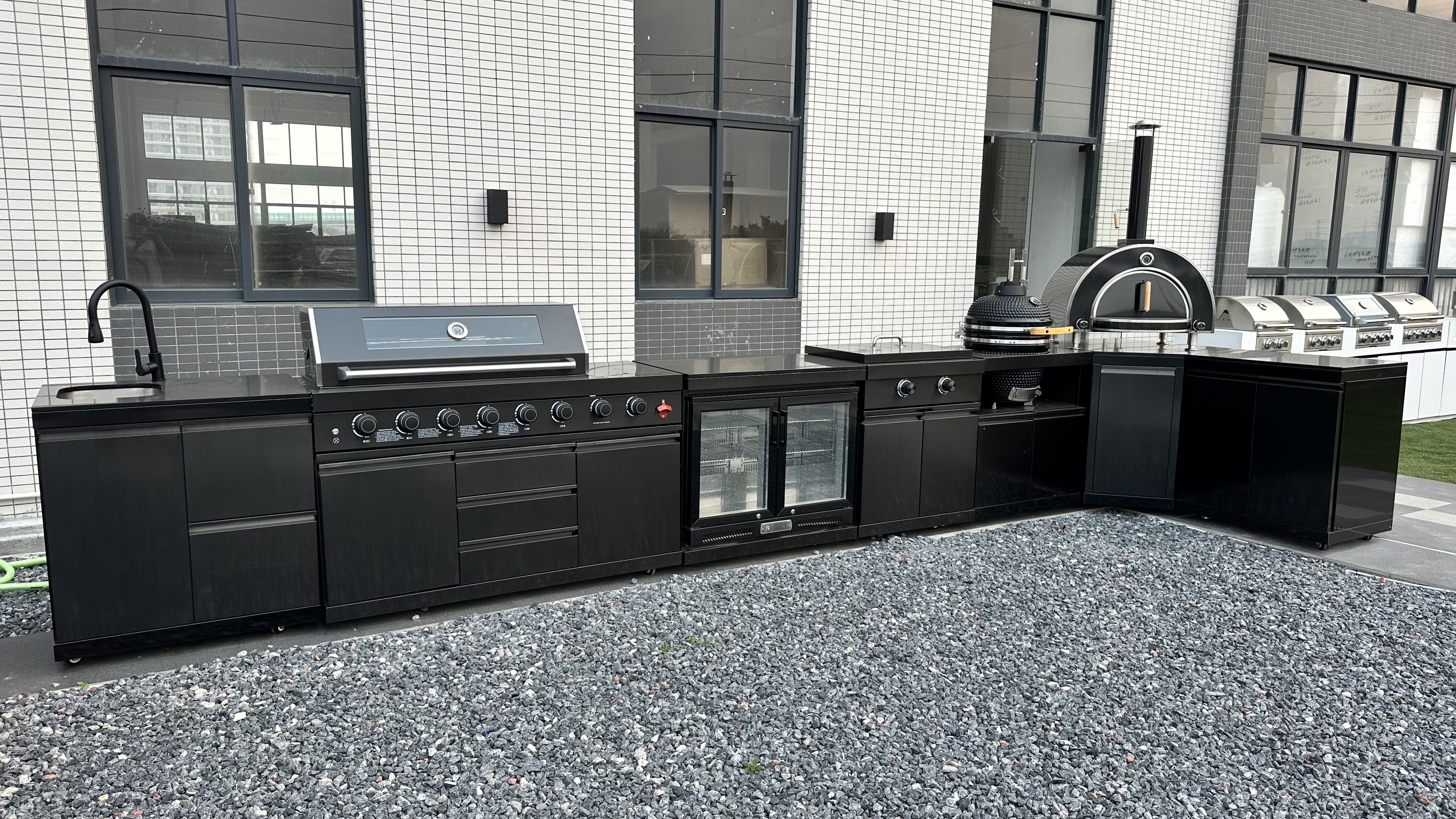 Custom modular outdoor kitchen system with grill, sink and stainless steel cabinets Custom modular outdoor kitchen system with grill, sink and stainless steel cabinets